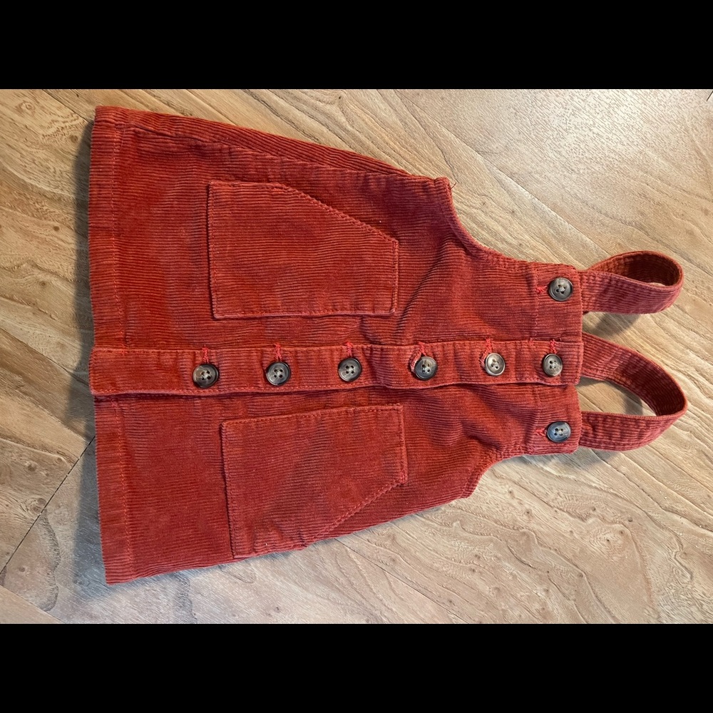 Little Girls corduroy jumpers in orange and cheetah.